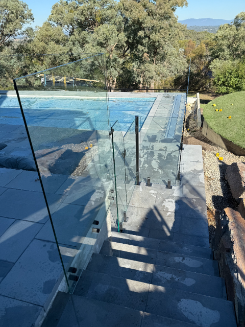 Glass pool fencing at sunset